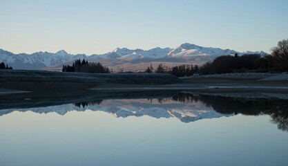 Mount Cook Aoraki mountain mirror reflection panorama at Lake Pukaki, alpine soft light sunset landscape, Southern Alps, South Island, New Zealand