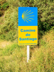 Traditional shell sign painted on the way. Direction sign for pilgrims in Saint James way, Camino de Santiago de Compostela, Spain