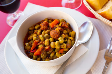 Habas a la Catalana, stew of beans with blood sausage, chorizo and bacon seasoned with paprika