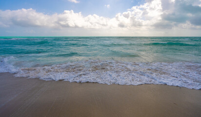 Refreshing sea beach breeze. Bright sea beach sunlight. Dreamy sea beach scenery. Stunning sea beach wallpaper. Peaceful ocean retreat. Ocean vibes. Sparkling ocean water. Tranquil ocean atmosphere.