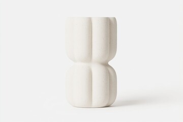 Minimalist, cream-colored vase with textured vertical panels