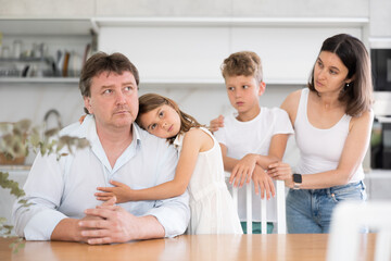 Fototapeta premium Upset family with son and daughter arguing in kitchen at home