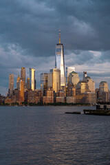 Obraz premium NYC, New York City Skyline with dramatic sky clouds. New York Skyscrapers. New York City skyline, cityscape of Manhattan in USA. Panoramic view on Manhattan. New York skyline. NYC, NY city.