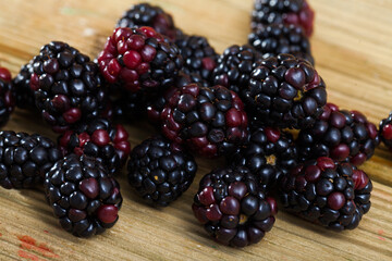 Healthy food, blackberry closeup on wooden table