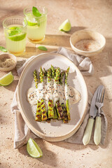Fresh grilled asparagus with sesame and lime.