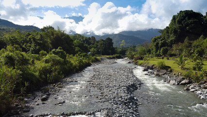 A riverside campsite facing Mount Kinabalu located at Melangkap, Kota Belud. The Panataran River...