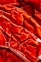  Red Wrinkled Texture.Abstract Red Metallic Texture. Silver foil folds with red liquid.