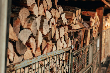 Wood heating.Stacked Firewood Storage Bins.Stacked Firewood Pile Outdoors