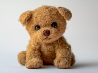 Fototapeta premium Realistic Hand-Sewn Stuffed Animal Photography Featuring a Cute Brown Puppy Toy on a Minimalist Background