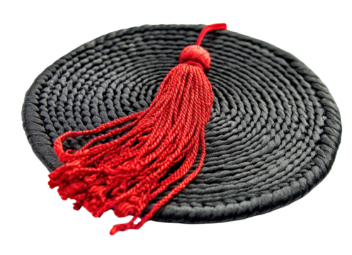 Traditional black mat with red tassel.
