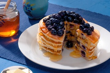 Wild Berry Pancake Stack – Topped with Mixed Berries and Mint Garnish
