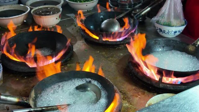 A halal rice noodle shop in Nanning, Guangxi, China is busy cooking rice noodles.