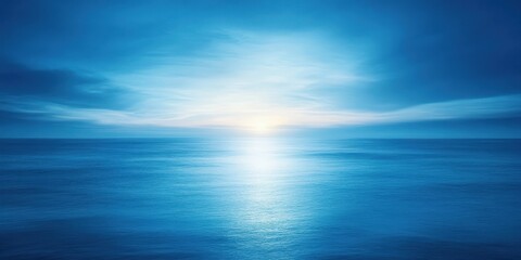 Obraz premium Tranquil ocean sunrise bathed in soft light.
