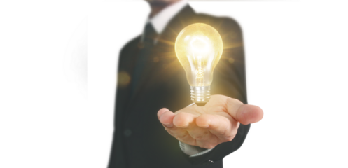 Illuminating ideas business professional holding light bulb studio image bright environment close-up innovative concepts for inspiration