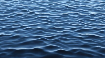Obraz premium A serene image of gentle waves rippling across a calm body of water, reflecting light in various shades of blue.
