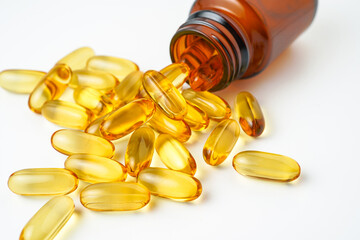 Vitamin capsules in a bottle, soft gels, Fish oil capsules, omega 3, omega 9, vitamin D, vitamin E