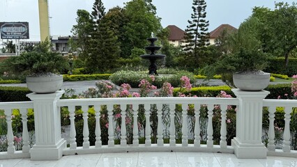Garden fence with flowers,Wedding flower and decoration,Beautiful romantic festive place made with wooden square and floral roses decorations for outside wedding ceremony in Banquet hall.