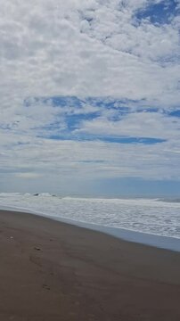 The beauty of black sand beach under clear sky