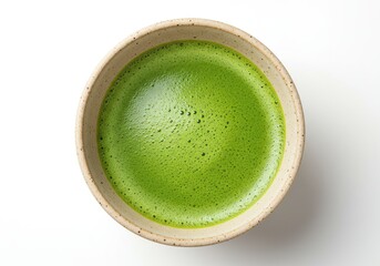 Close up shot of a bowl filled with vibrant green matcha tea against a white background surface view