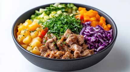 A colorful healthy meal bowl with grilled chicken and fresh vegetables, including diced pineapple, red bell peppers, and purple cabbage, presented in a black bowl, and vibrant and nutritious food