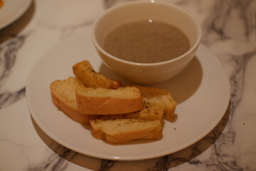 Creamy Mushroom Soup with Garlic Bread Slices