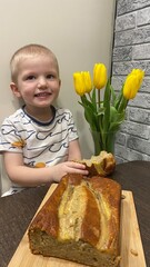 Little boy with a bouquet of tulips on March 8