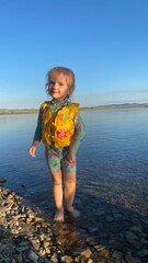 little girl is swimming in the sea