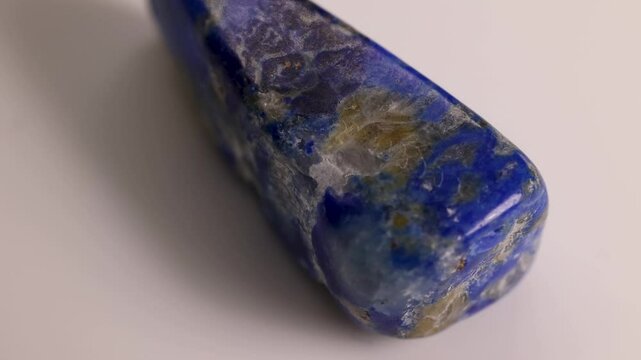 Rotating Lapis Lazuli Stone on White Surface