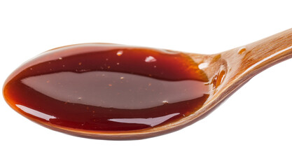 Sweet and spicy sauce on a spoon, isolated on white background