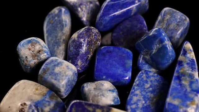 Rotating Lapis Lazuli Stones on Black Background