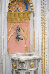 Historic fountain with ornate design in an old city square