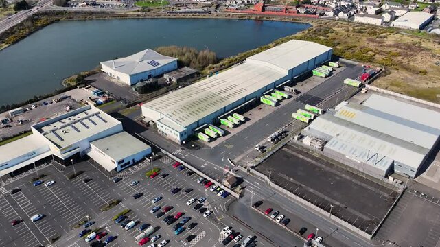 Aerial video of Asda Regional Distribution Centre and Asda Superstore Larne Industrial Estate Port Of Larne Business Park Northern Ireland 07-04-25