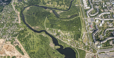 suburban residential neighborhood in a sunny summer day. aerial panoramic view. drone photo.