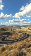 Fototapeta premium Winding highway through dry mountain landscape