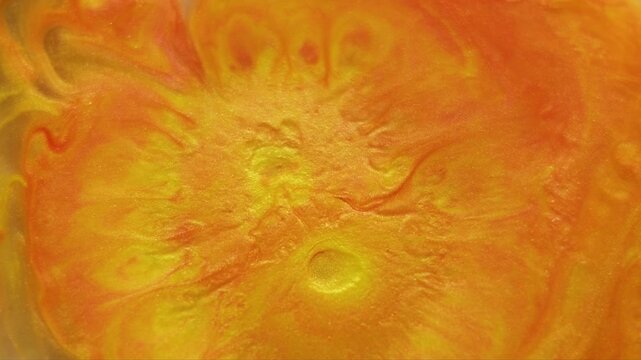 Ink explosion. Lava paint. Bright orange drop blob dye flow fantasy texture. Vivid acrylic spill abstract wave splash blur background.