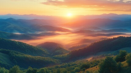 Fototapeta premium Sunrise Over Misty Mountain Ranges: A Breathtaking Panorama