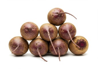 Obraz premium A group of nine beets stacked in a pyramid shape on a white background in a studio setting close up view