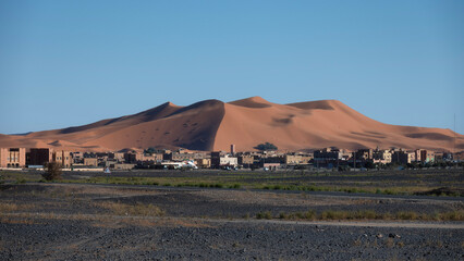 Sunset over the Sahara Desert dunes in Merzouga, Morocco
