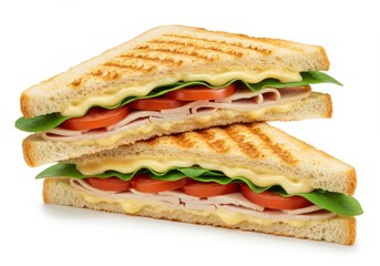 A stacked view of two triangle shaped sandwiches with visible turkey tomato and lettuce fillings inside it