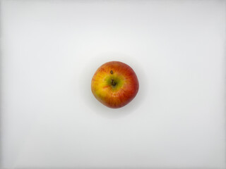 Fresh juicy red apple on white background in the center of the image front view