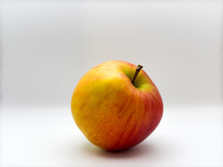 Fresh juicy red apple on white background in the center of the image front view