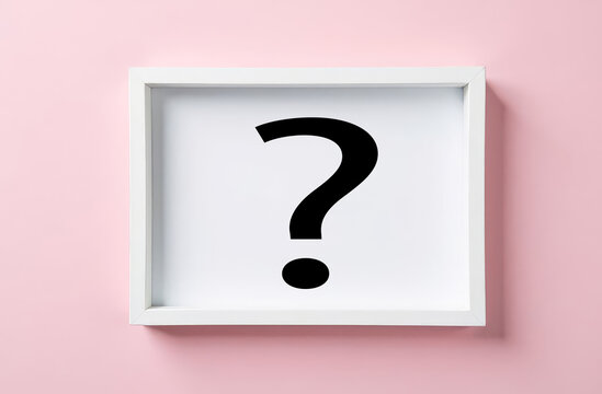 a framed question mark on a pink background