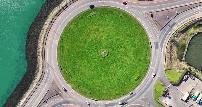 Slow motion aerial video of vehicles on Larne Harbour Roundabout A8 Larne road Ballymena road, Belfast road, Northern Ireland 