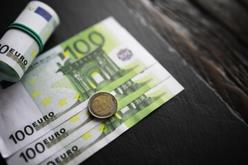 100 euro banknote pack and wood bankground. Currency, financial