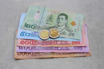 Banknotes with coins of the Thai baht money