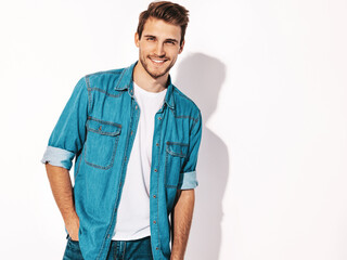 Fototapeta premium Portrait of handsome smiling stylish hipster lumbersexual businessman model dressed in jeans clothes. Fashion man. Isolated on white