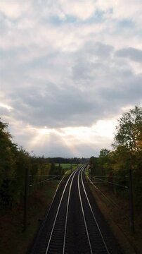 Time-lapse at sunrise with railtracks anda  beautiful cloudscape	

