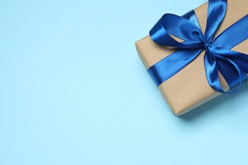 Beautiful gift box on color background, top view