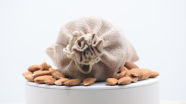 almod bag, Almonds with leaf in bag from sacking isolated on white background, Standing Empty design Pouch Bag almond  Mockup on isolated  with clipping path