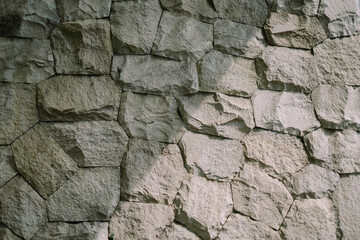Sturdy stone cladding wall texture for backgrounds or architecture
